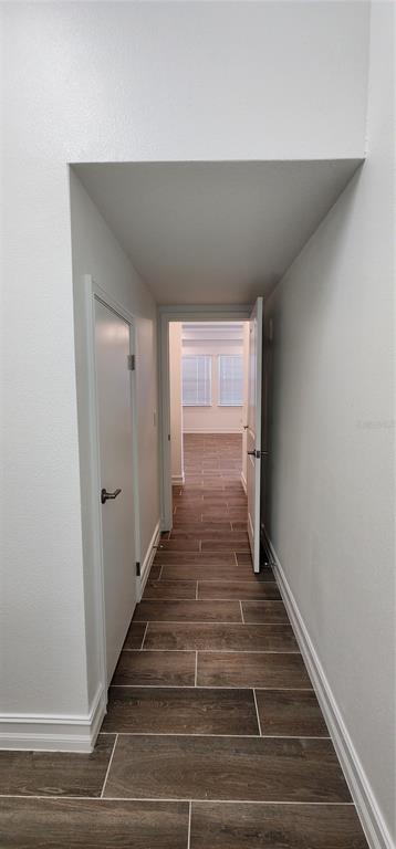 29868 Picana Lane Wesley Chapel, FL 33543 - Photo 47 of 75 a view of a hallway with wooden floor and staircase