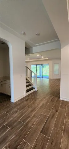 a living room with granite countertop furniture a fireplace and potted plants