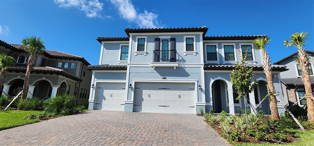 29868 Picana Lane Wesley Chapel, FL 33543 - Photo 59 of 75 a front view of a house with a yard