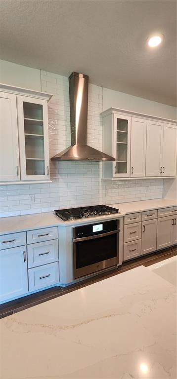 29868 Picana Lane Wesley Chapel, FL 33543 - Photo 6 of 75 a kitchen with stainless steel appliances granite countertop a stove a sink and a microwave