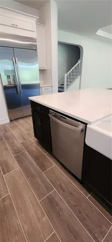 a view of microwave and cabinets