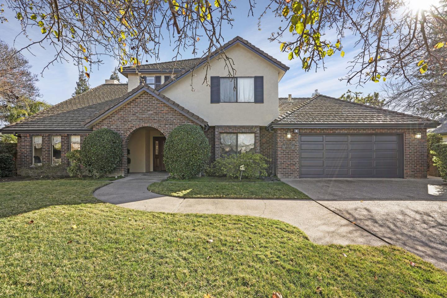 1636 Timberlake Circle Lodi, CA 95242 - Photo 1 of 44 a front view of a house with a yard and garage