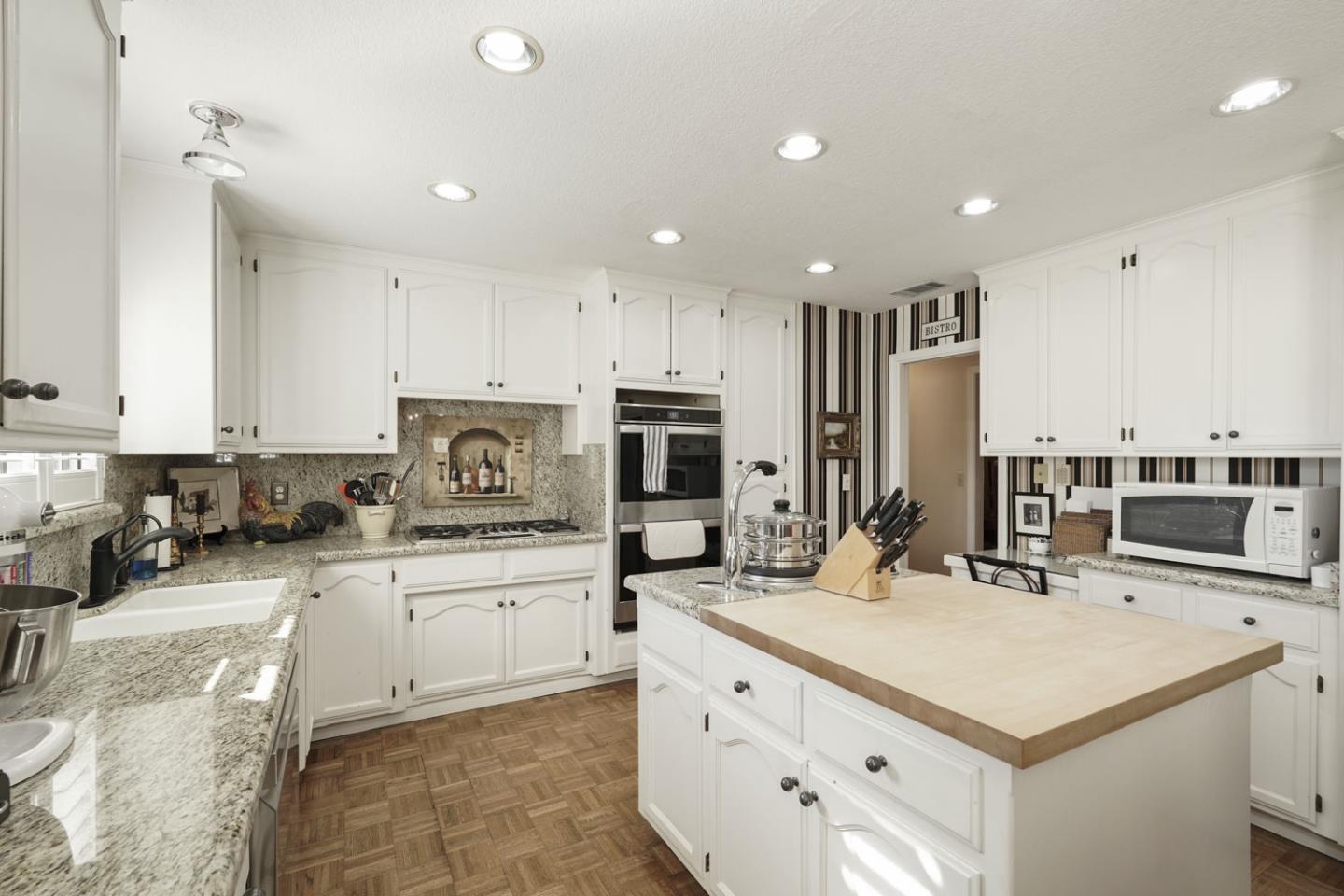1636 Timberlake Circle Lodi, CA 95242 - Photo 11 of 44 a kitchen with a sink stove and cabinets