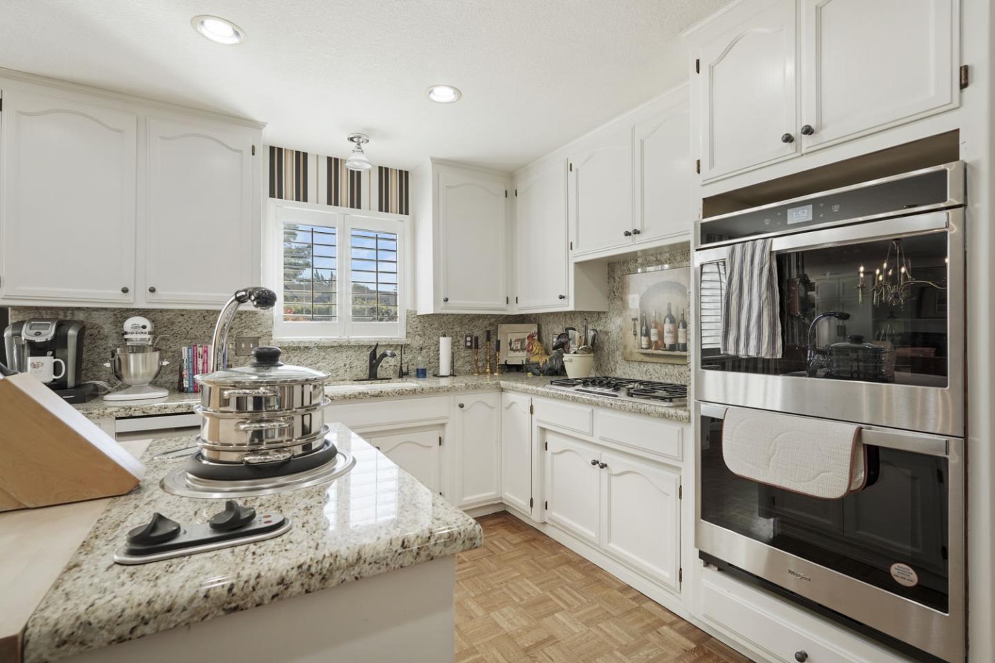 1636 Timberlake Circle Lodi, CA 95242 - Photo 12 of 44 a kitchen with stainless steel appliances granite countertop a stove a sink and a microwave
