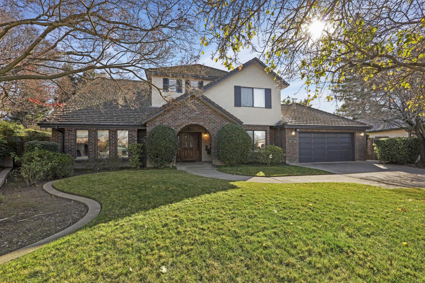 1636 Timberlake Circle Lodi, CA 95242 - Photo 2 of 44 a front view of a house with a yard and garage