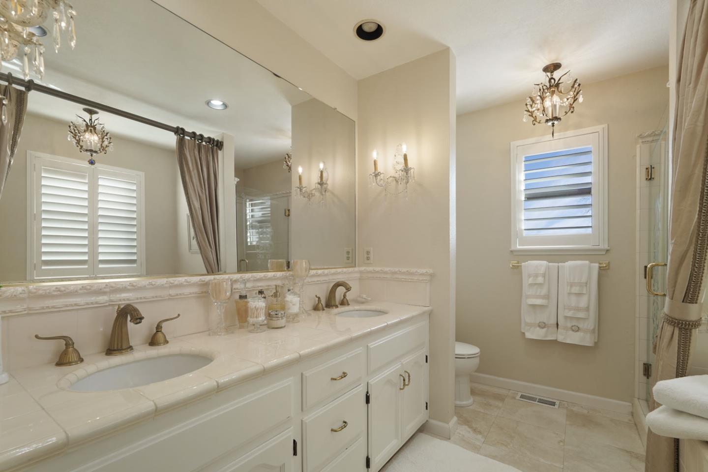 1636 Timberlake Circle Lodi, CA 95242 - Photo 27 of 44 a bathroom with double sink and a mirror