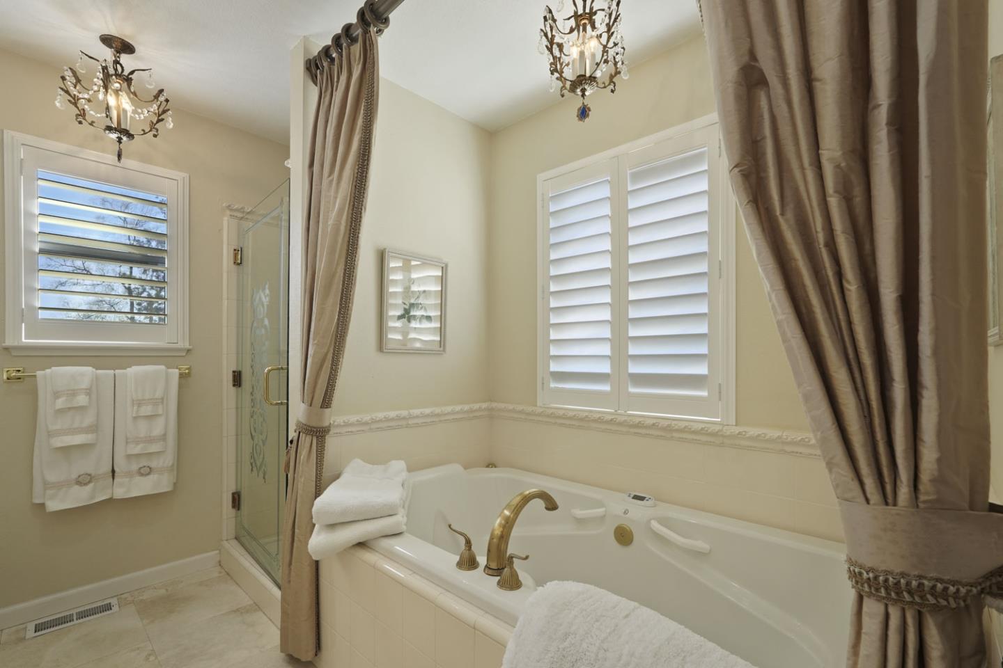 1636 Timberlake Circle Lodi, CA 95242 - Photo 29 of 44 a bathroom with a tub a sink and a window