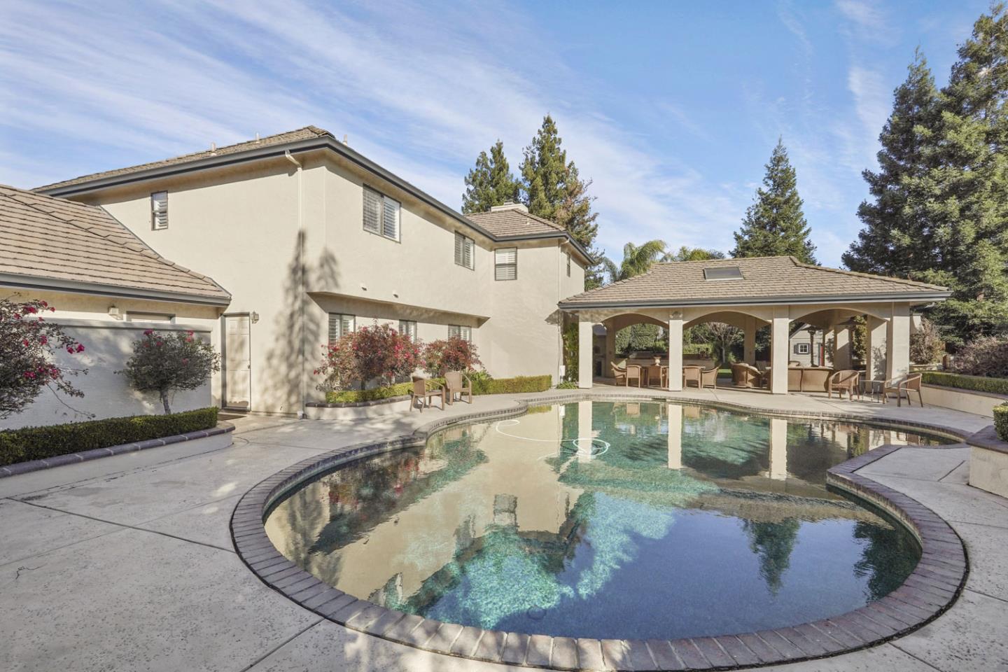 1636 Timberlake Circle Lodi, CA 95242 - Photo 31 of 44 a view of a house with a swimming pool