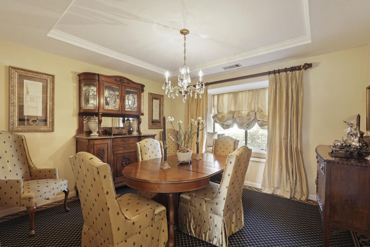 1636 Timberlake Circle Lodi, CA 95242 - Photo 8 of 44 a dining room with furniture a chandelier and window