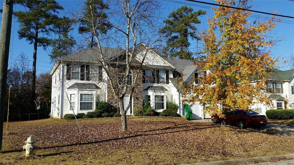 4660 Redbranch Drive Decatur, GA 30035 - Photo 1 of 1 a front view of a house with a garden