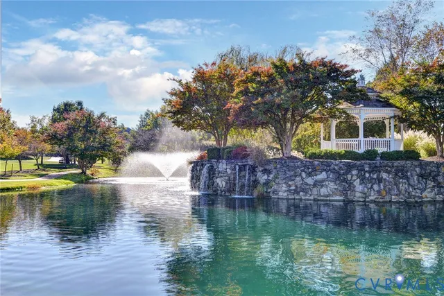 a view of swimming pool with trees in the background
