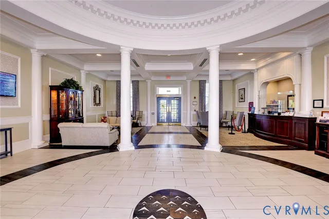 a living room with a couch and a view of living room