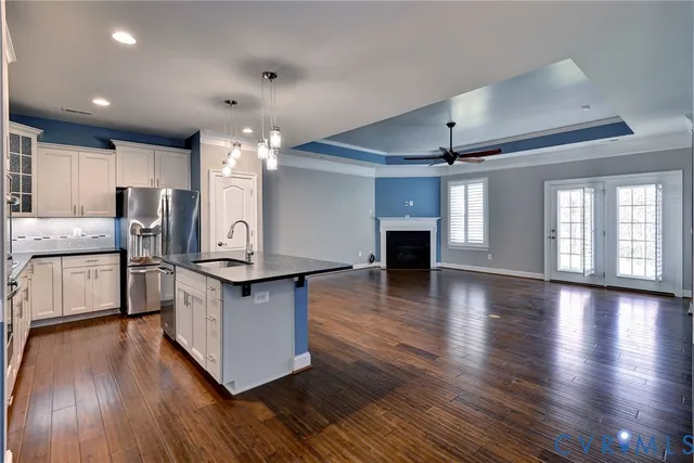 a kitchen with stainless steel appliances granite countertop a stove oven and a refrigerator