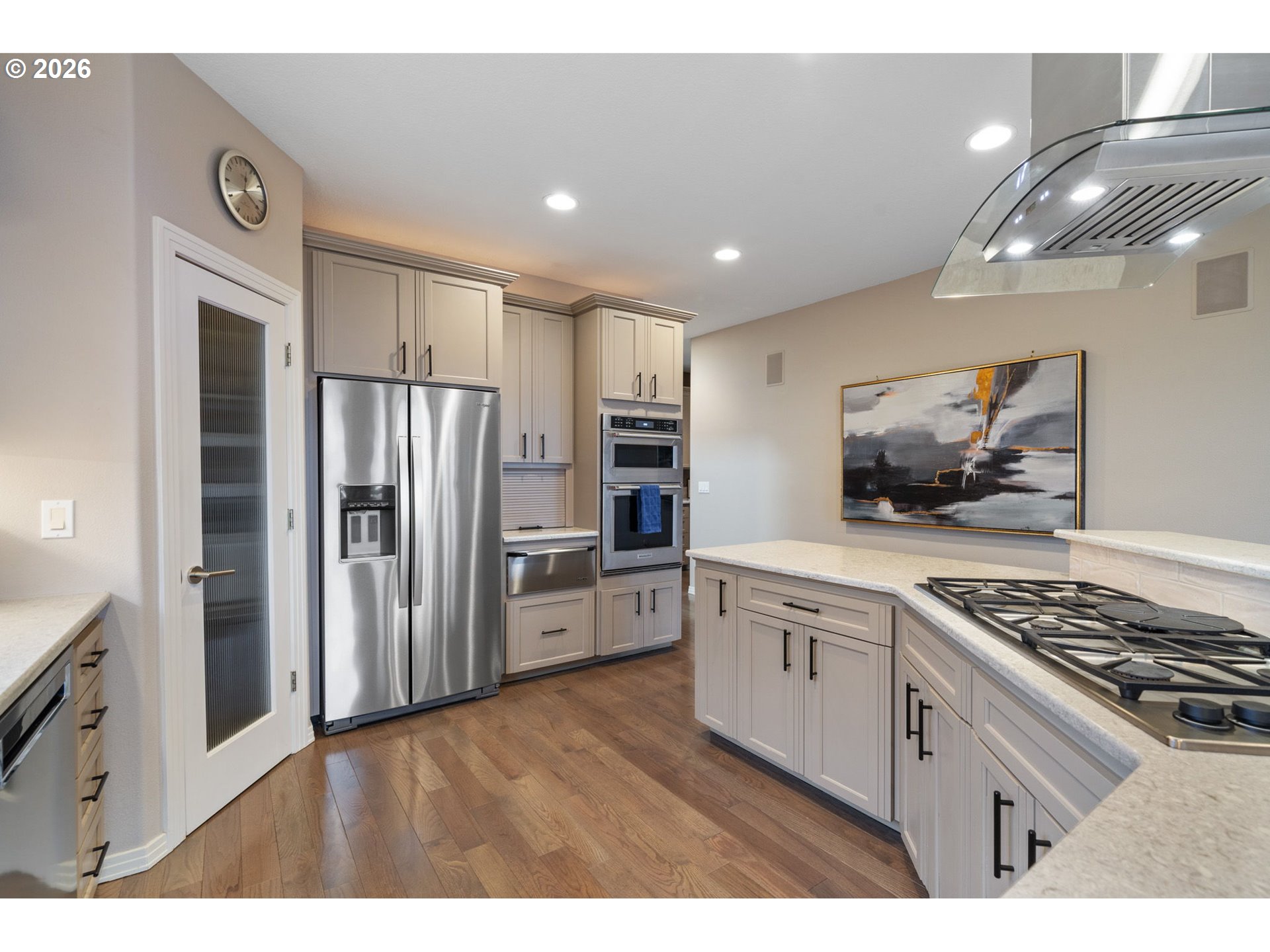 2305 Northwest Douglas Street Camas, WA 98607 - Photo 12 of 46 a kitchen with stainless steel appliances granite countertop a refrigerator and a stove top oven