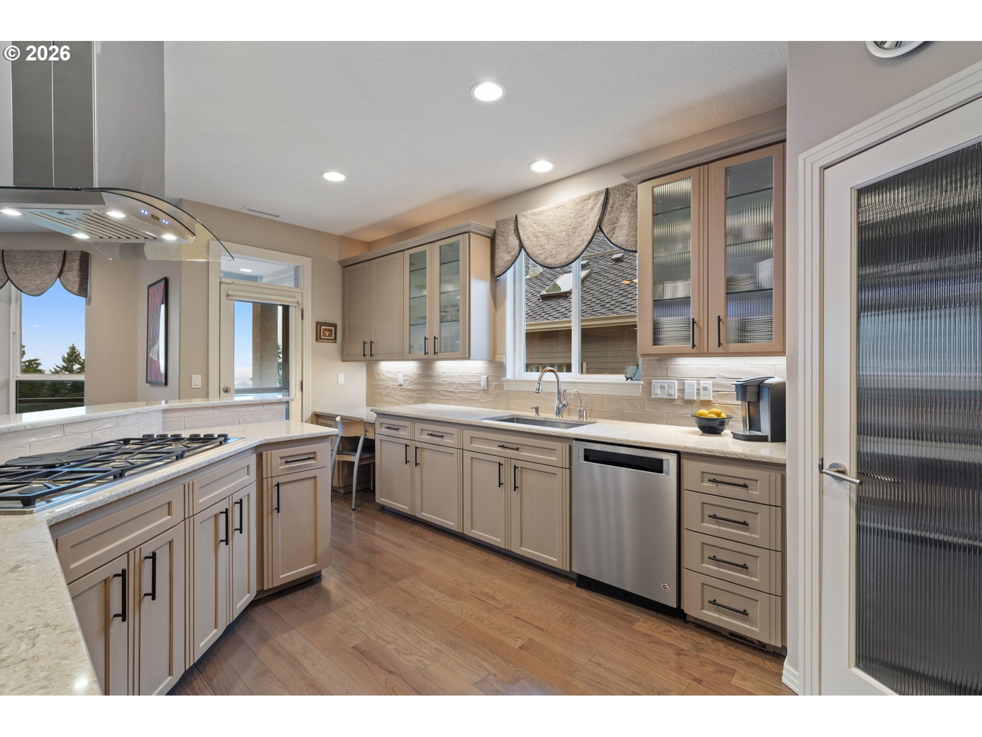 2305 Northwest Douglas Street Camas, WA 98607 - Photo 13 of 46 a kitchen with stainless steel appliances granite countertop a stove and cabinets