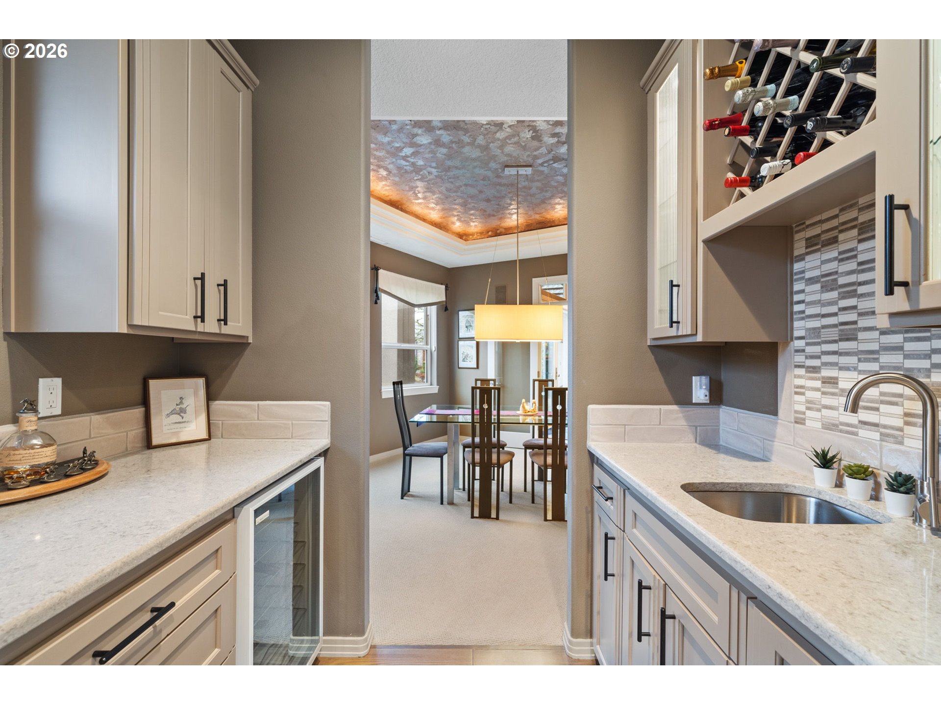 2305 Northwest Douglas Street Camas, WA 98607 - Photo 16 of 46 a kitchen with a sink cabinets and dining table