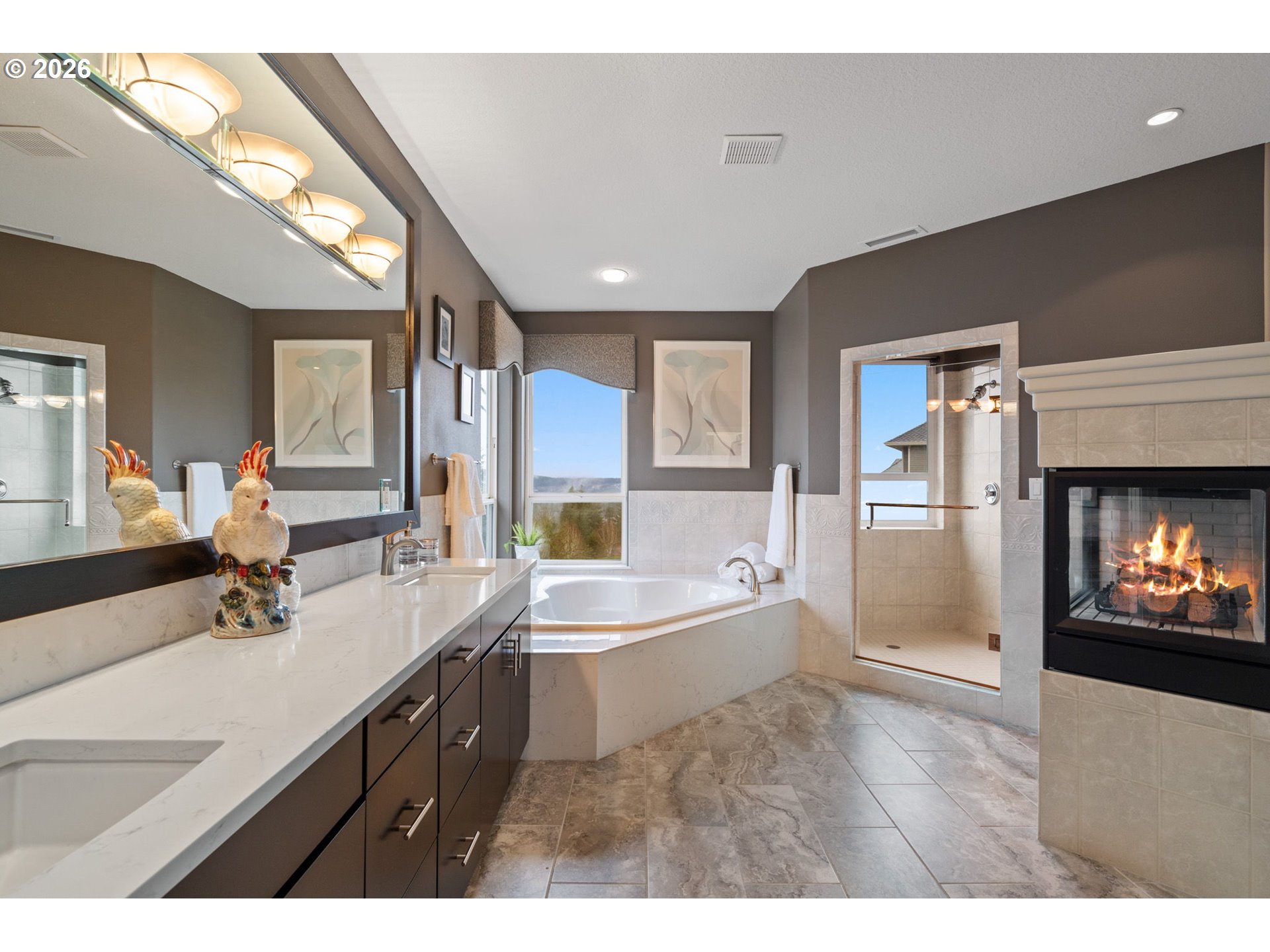 2305 Northwest Douglas Street Camas, WA 98607 - Photo 21 of 46 a bathroom with a double vanity sink a mirror and bathtub