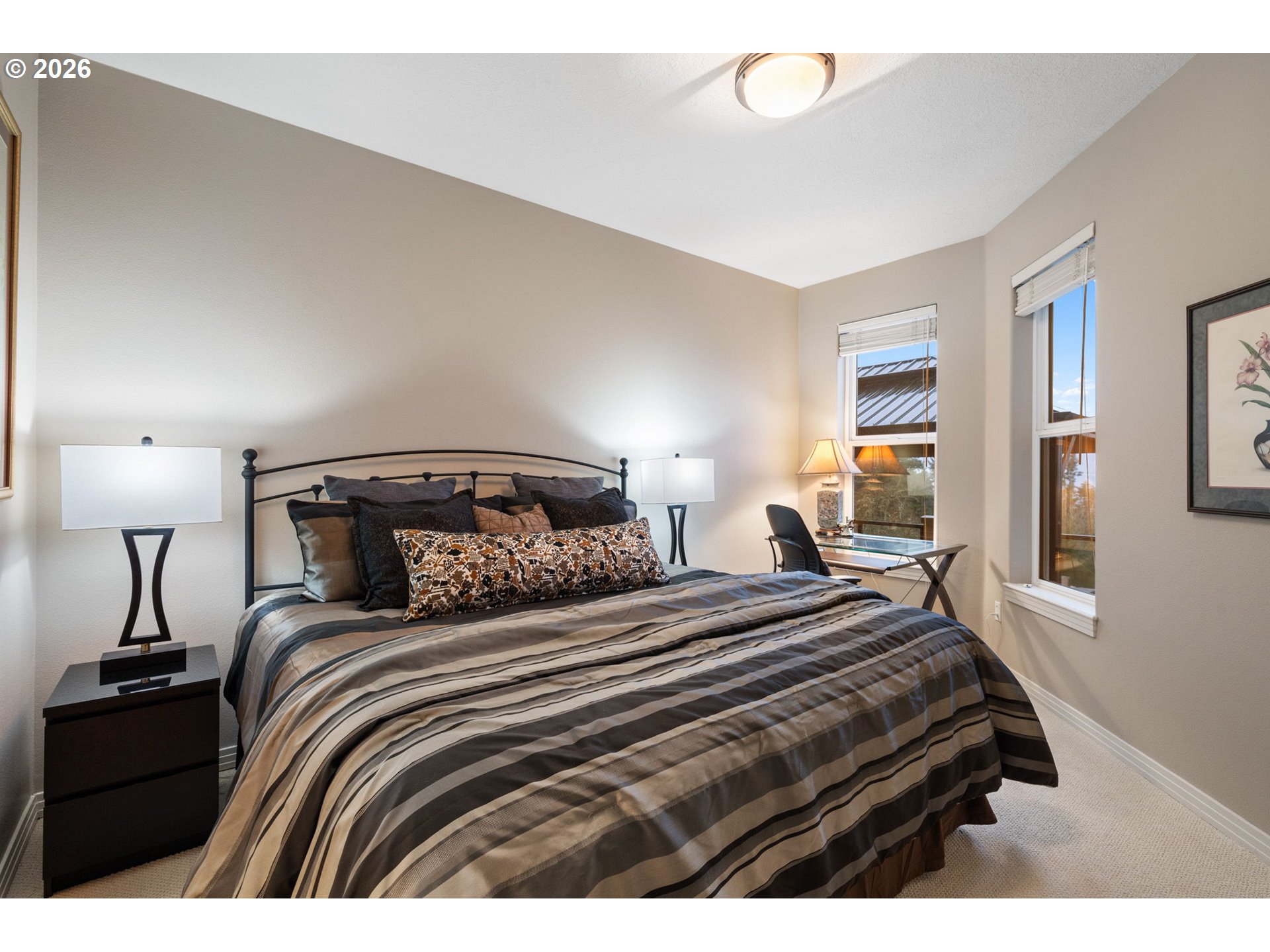 2305 Northwest Douglas Street Camas, WA 98607 - Photo 26 of 46 a bedroom with a bed and a lamp