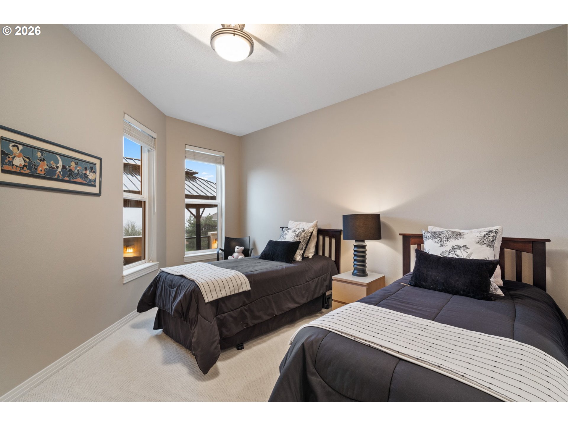 2305 Northwest Douglas Street Camas, WA 98607 - Photo 33 of 46 a bedroom with two beds and a large mirror