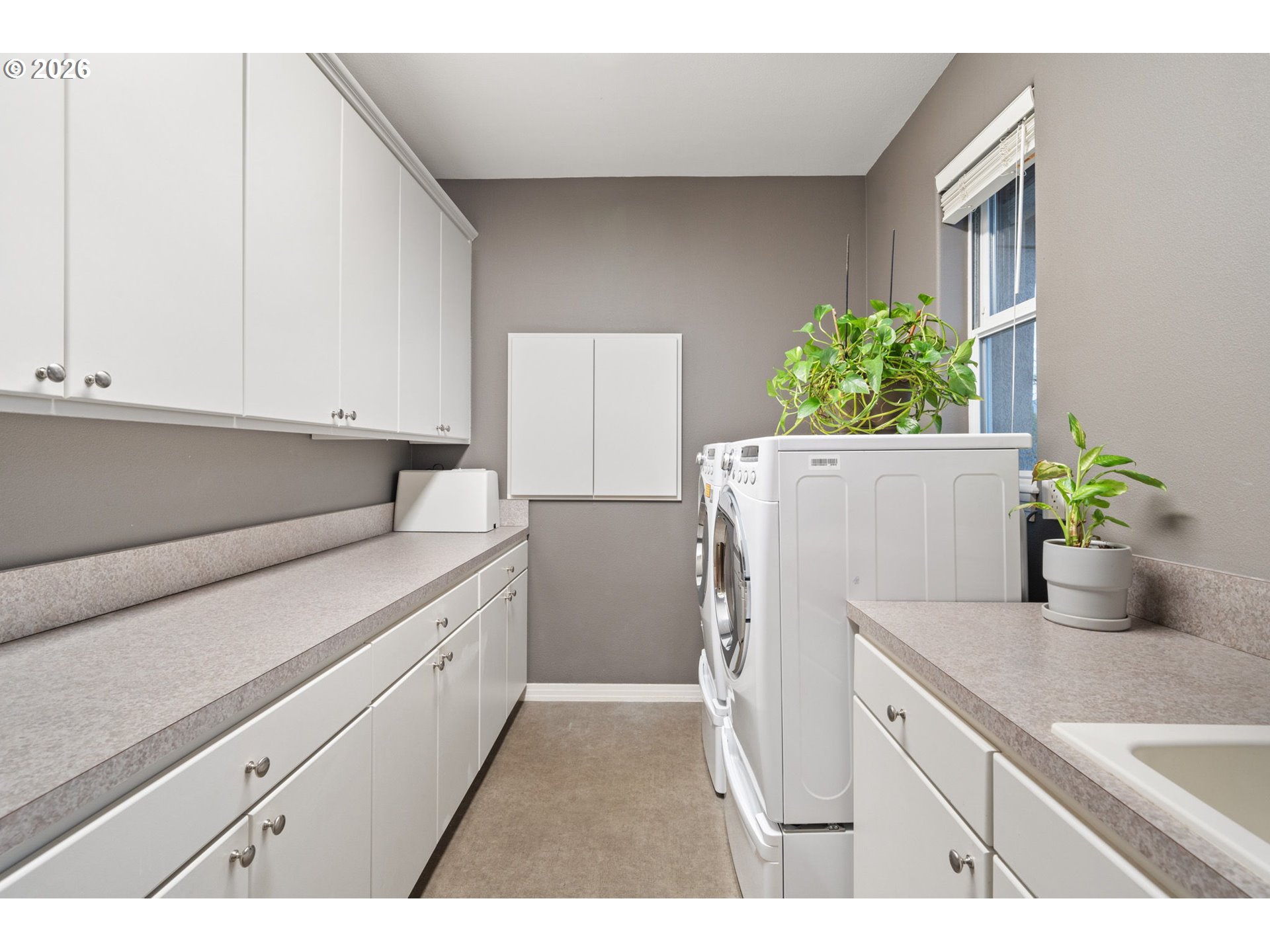 2305 Northwest Douglas Street Camas, WA 98607 - Photo 34 of 46 a utility room with cabinets washer and dryer