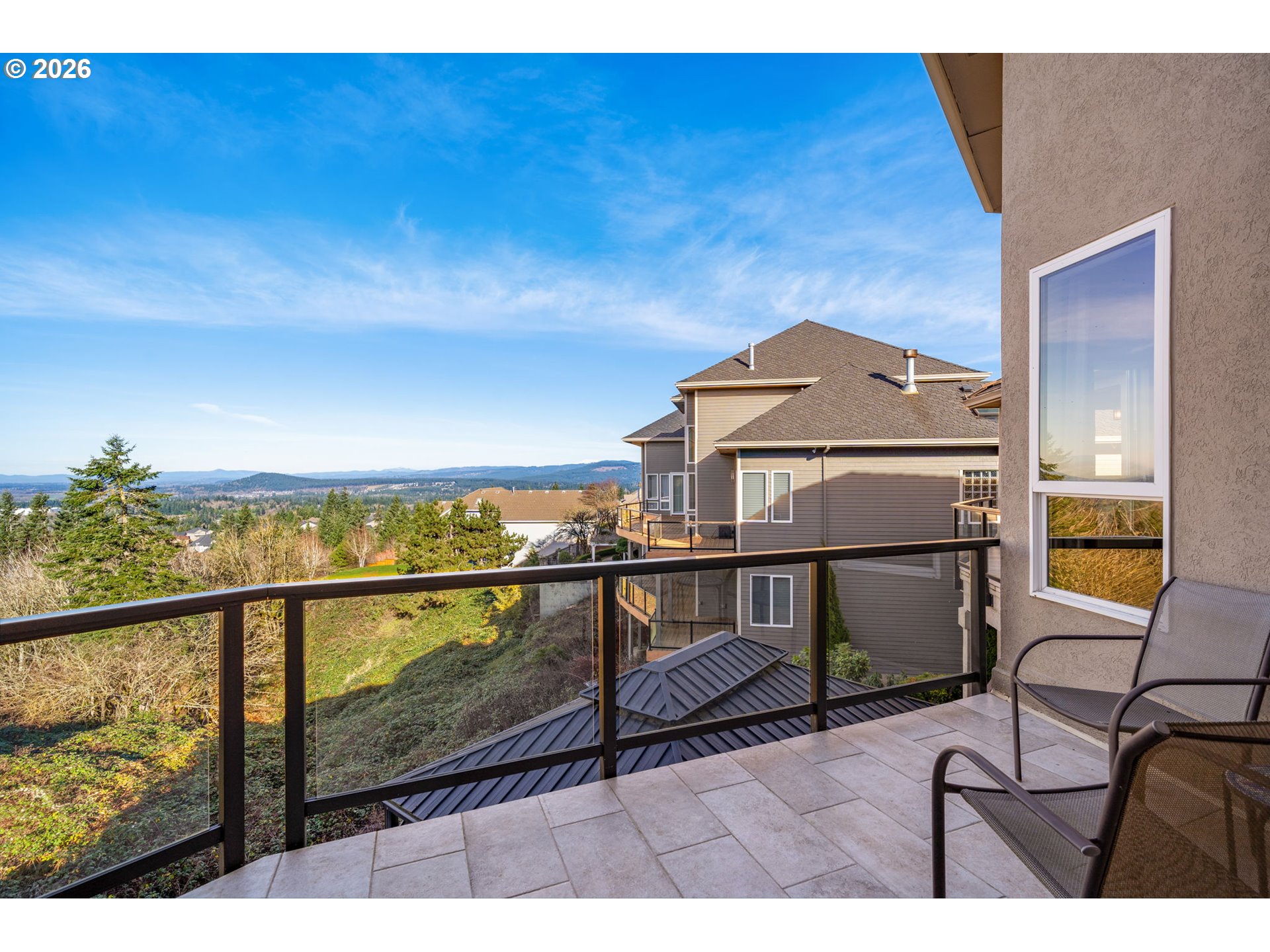 2305 Northwest Douglas Street Camas, WA 98607 - Photo 38 of 46 a view of a balcony with chair and wooden floor