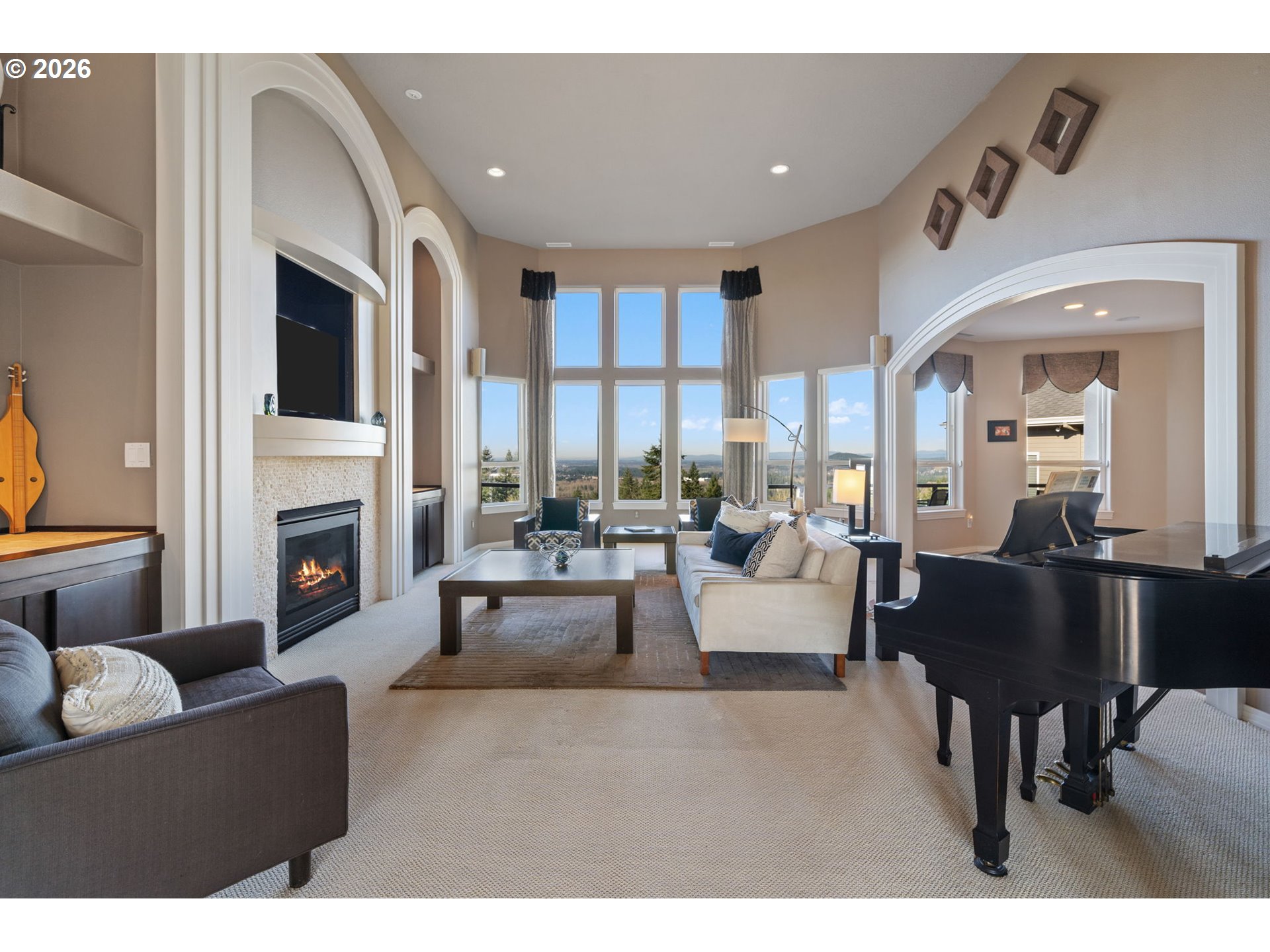 2305 Northwest Douglas Street Camas, WA 98607 - Photo 8 of 46 a living room with furniture a fireplace and a flat screen tv