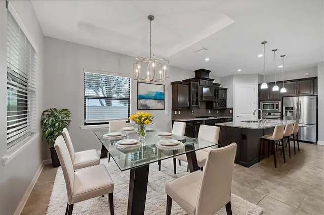a large kitchen with a large counter top appliances and cabinets