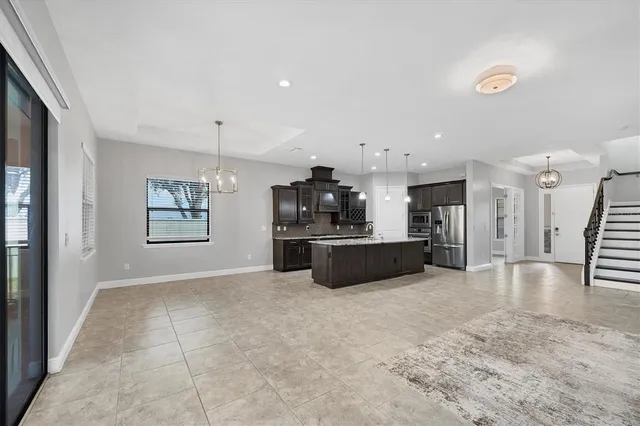 a view of an empty room and a window