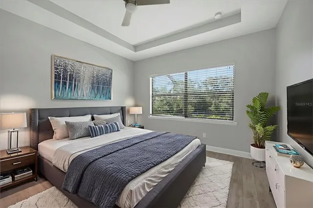 a bathroom with a granite countertop sink a large mirror and a shower