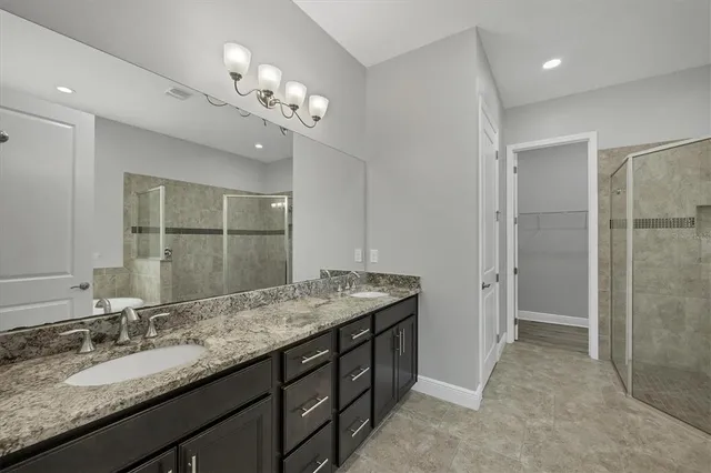 a bathroom with a glass shower door