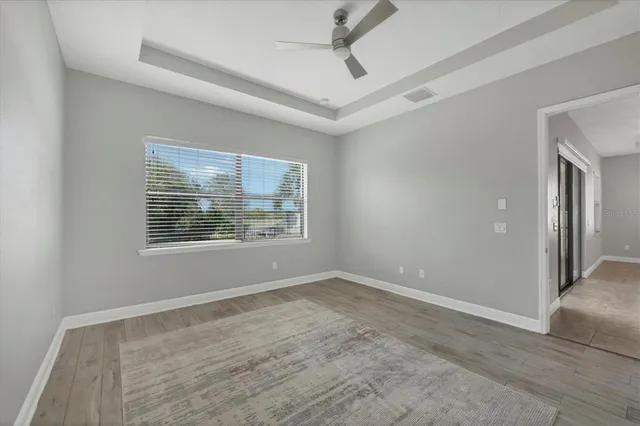 a swimming pool with outdoor seating and yard