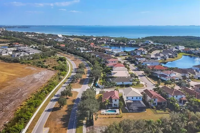 a view of a hallway with wooden floor and stairs