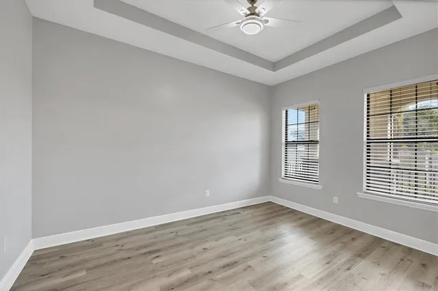 a kitchen with stainless steel appliances granite countertop a sink a stove and a wooden floors