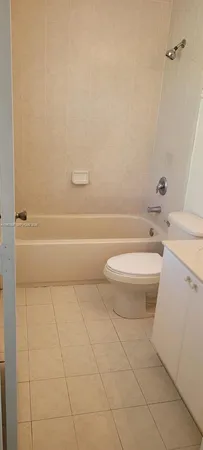 a bathroom with a toilet a sink and a bathtub