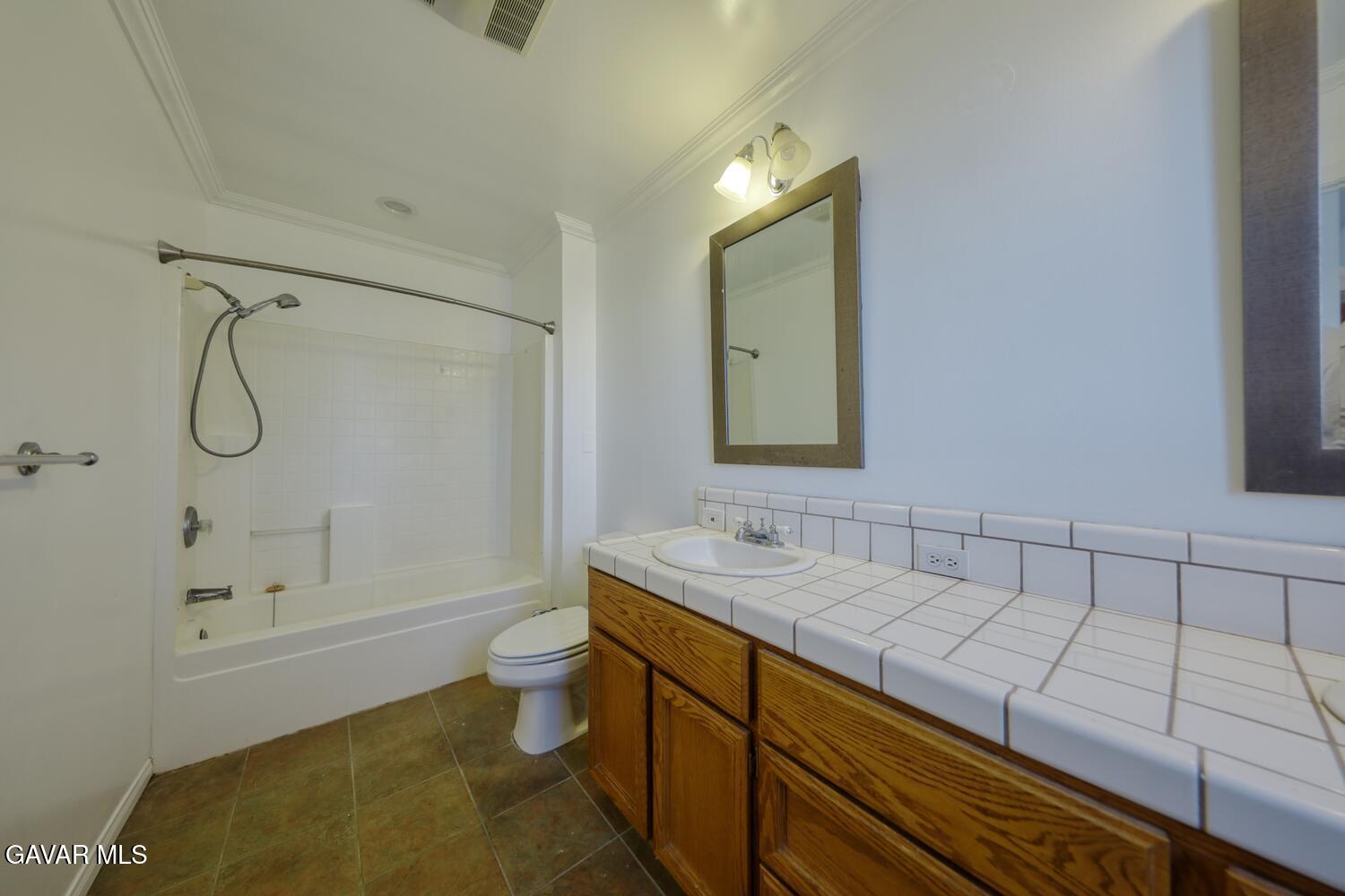 26801 Cabriolet Court Tehachapi, CA 93561 - Photo 29 of 60 a bathroom with a sink a toilet and shower