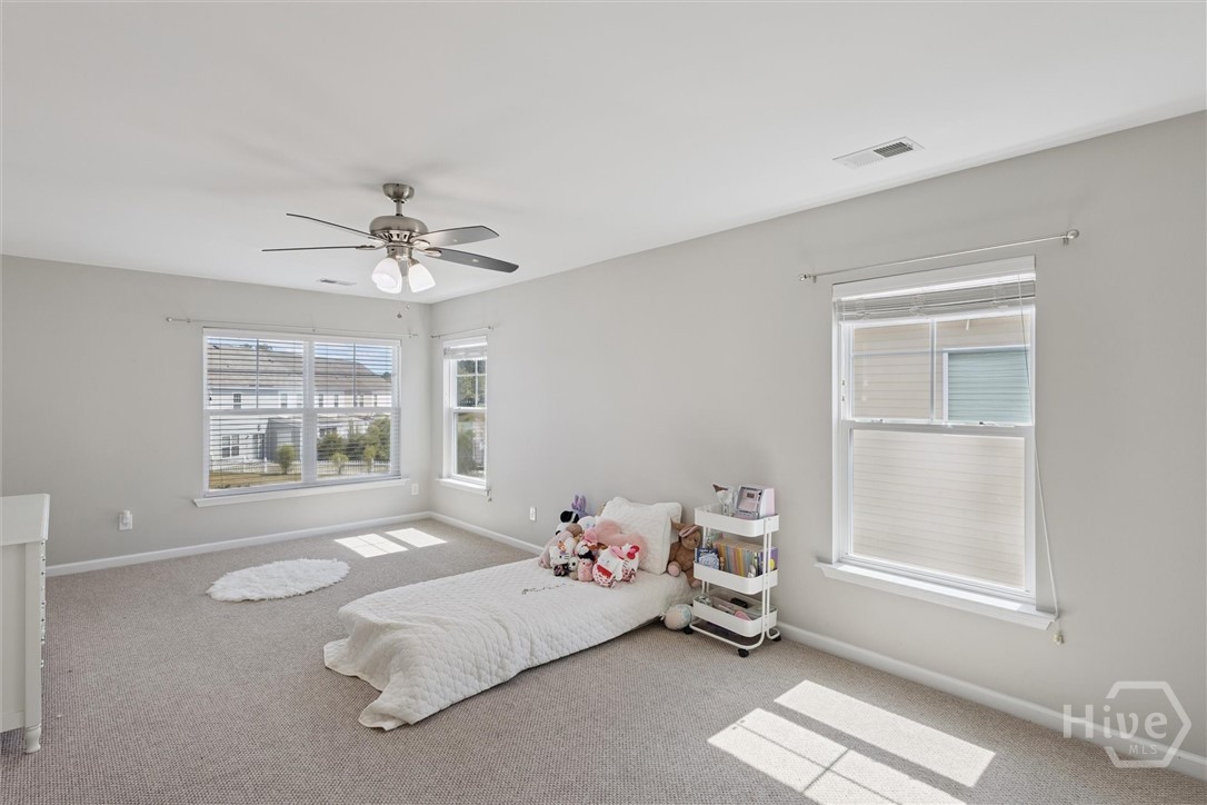 75 Timber Crest Court Savannah, GA 31407 - Photo 24 of 43 At the top of the stairs on the right is the first secondary bedroom measuring 11'7"x22'7".