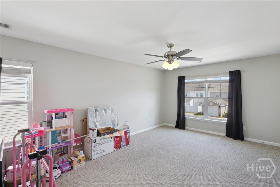 75 Timber Crest Court Savannah, GA 31407 - Photo 26 of 43 Moving to the left, the second upstairs bedroom is presently storing items ready to box for moving. This room measures 12'9"x19'6".