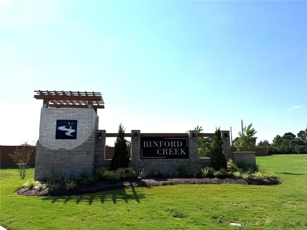 a view of barbeque area with seating area