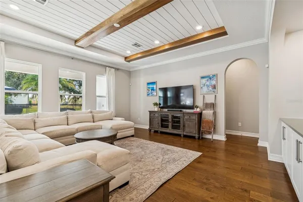 a kitchen with stainless steel appliances kitchen island granite countertop a table and chairs in it