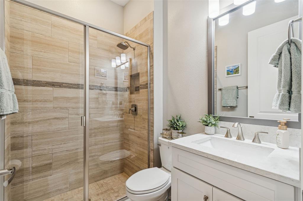 2519 Cordoba Ranch Boulevard Lutz, FL 33559 - Photo 25 of 77 a bathroom with a sink a toilet and shower