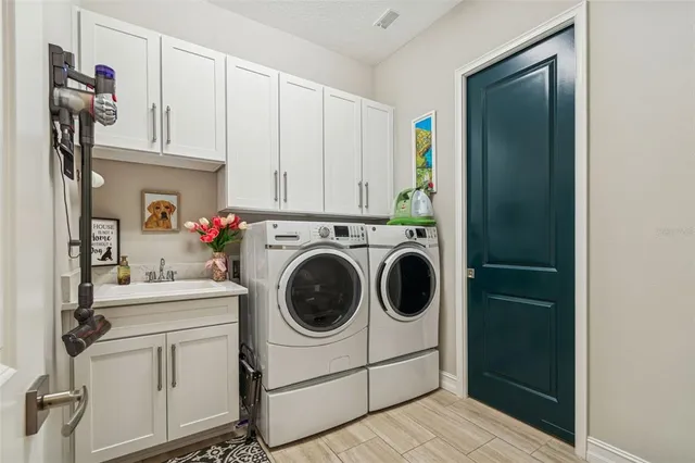 a bathroom with a double vanity sink and a mirror