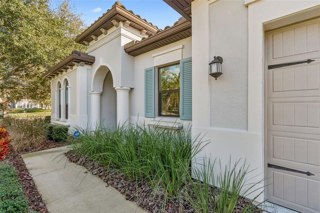 2519 Cordoba Ranch Boulevard Lutz, FL 33559 - Photo 3 of 77 a view of a white house with a small yard and plants
