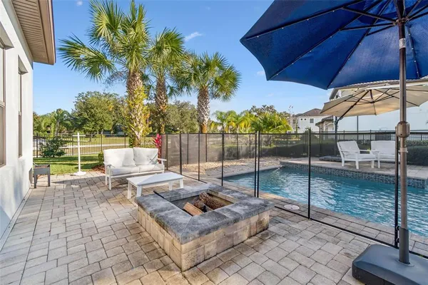 a view of a backyard with sitting area