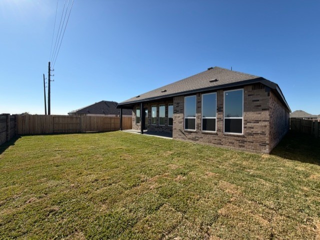 8207 Holly Blue Drive Rosharon, TX 77583 - Photo 3 of 28 a front view of a house with a yard