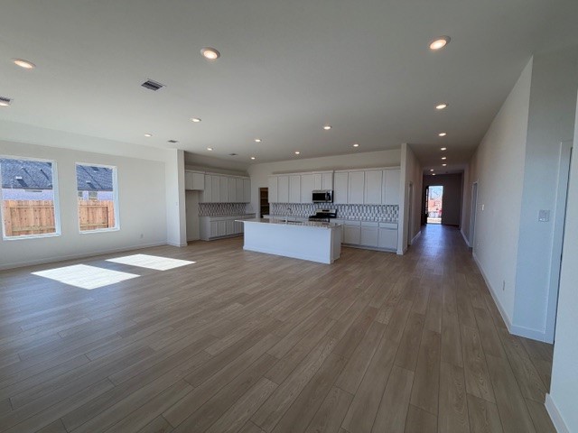 8207 Holly Blue Drive Rosharon, TX 77583 - Photo 4 of 28 a view of a kitchen with a sink and a large window