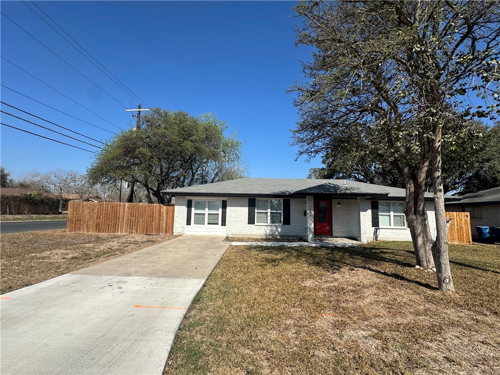 1001 East Hefferman Street Beeville, TX 78102 - Photo 3 of 12 front view of a house with a yard
