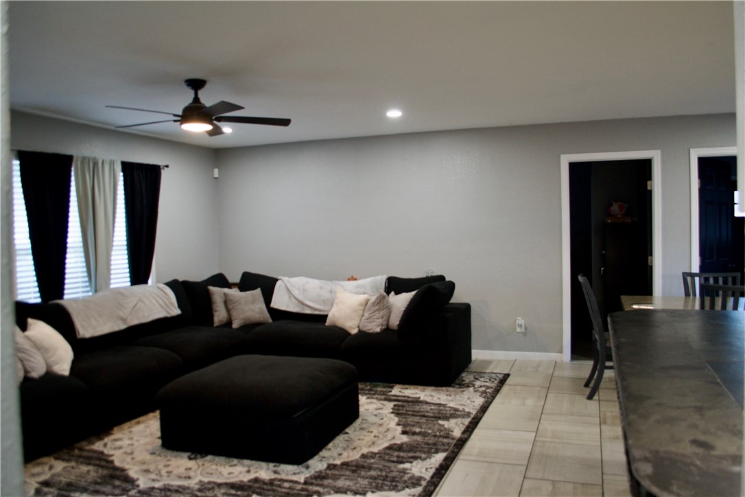 1001 East Hefferman Street Beeville, TX 78102 - Photo 10 of 12 a living room with furniture and a ceiling fan