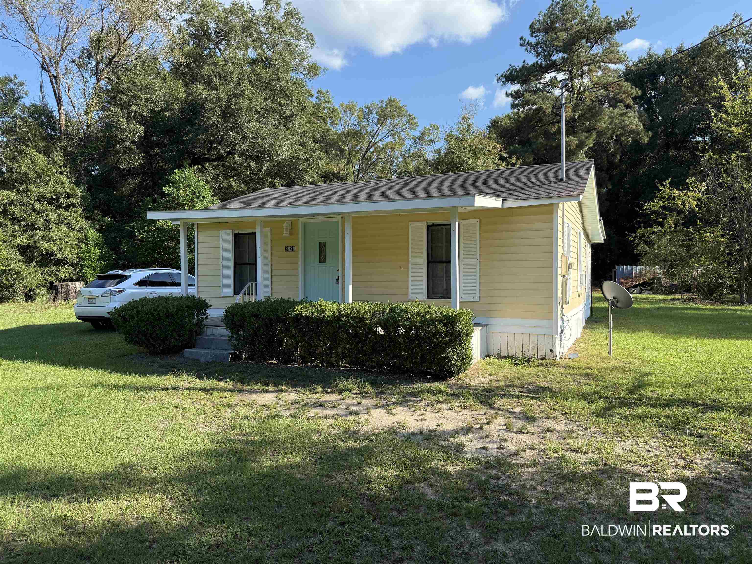 3630 Highway 29 Brewton, AL 36426 - Photo 2 of 13 View of front of house featuring a front lawn and covered porch