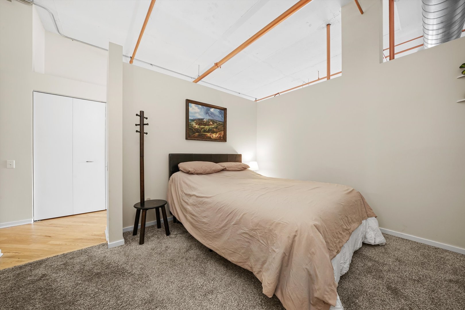 500 South Clinton Street, Unit 424 Chicago, IL 60607 - Photo 17 of 29 a bedroom with a bed and a table