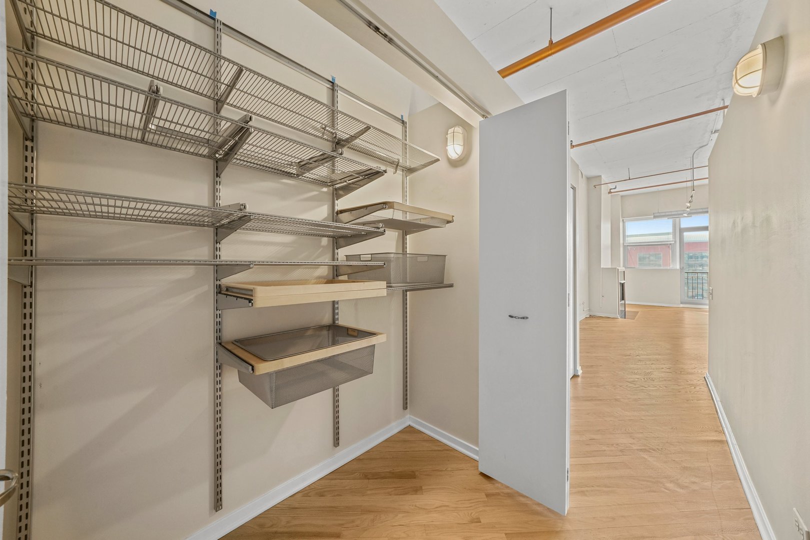 500 South Clinton Street, Unit 424 Chicago, IL 60607 - Photo 18 of 29 a view of walk in closet with empty racks